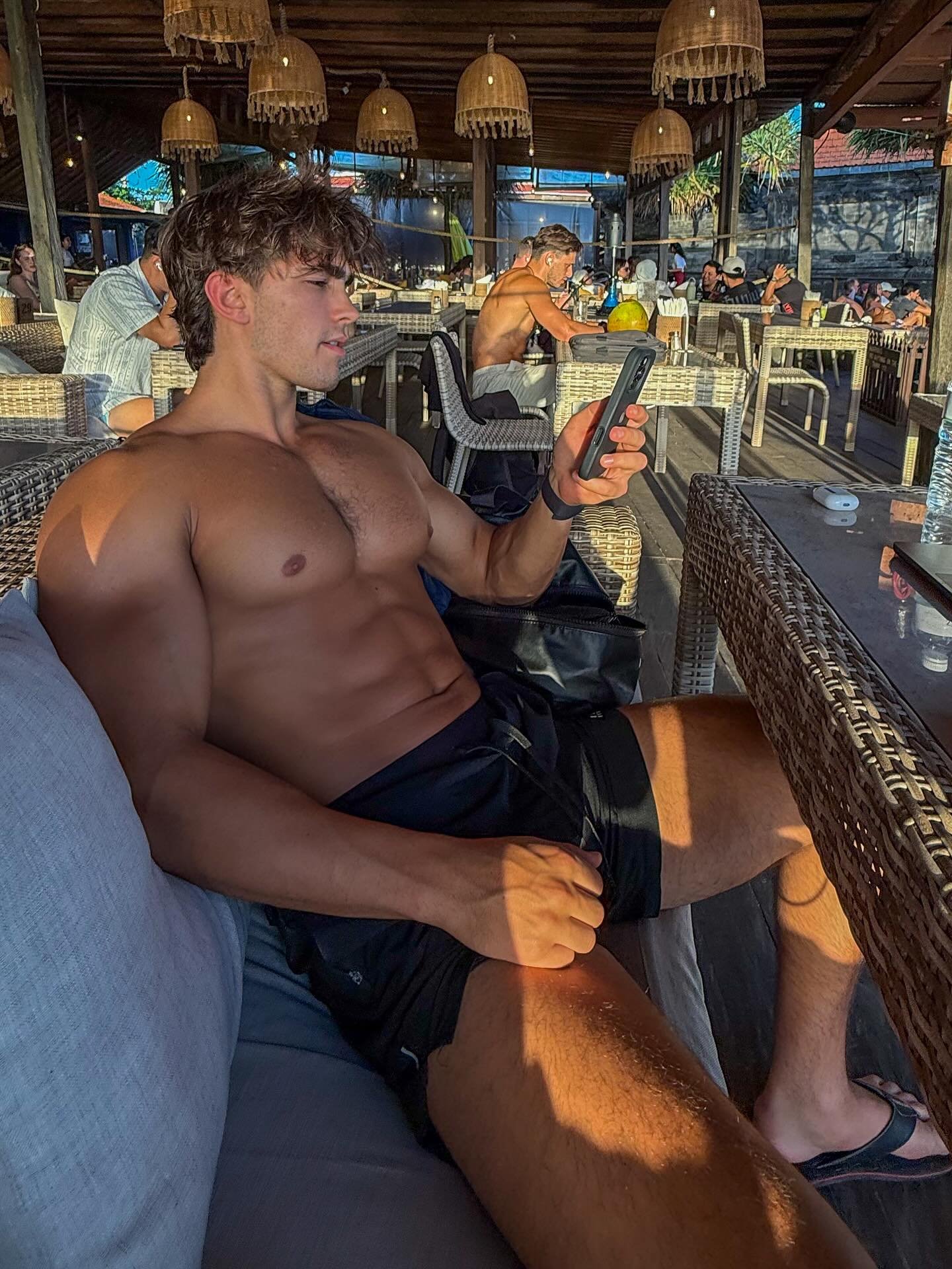 Relaxed pose showing off a gym built physique