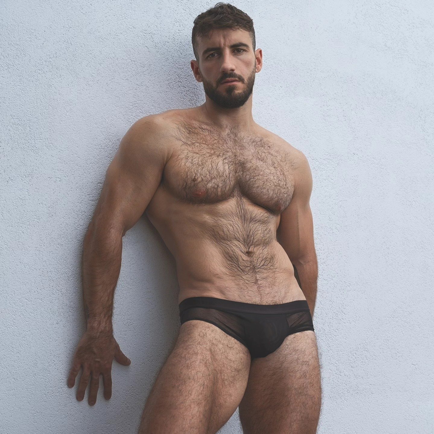 Shirtless, showing off his athletic body