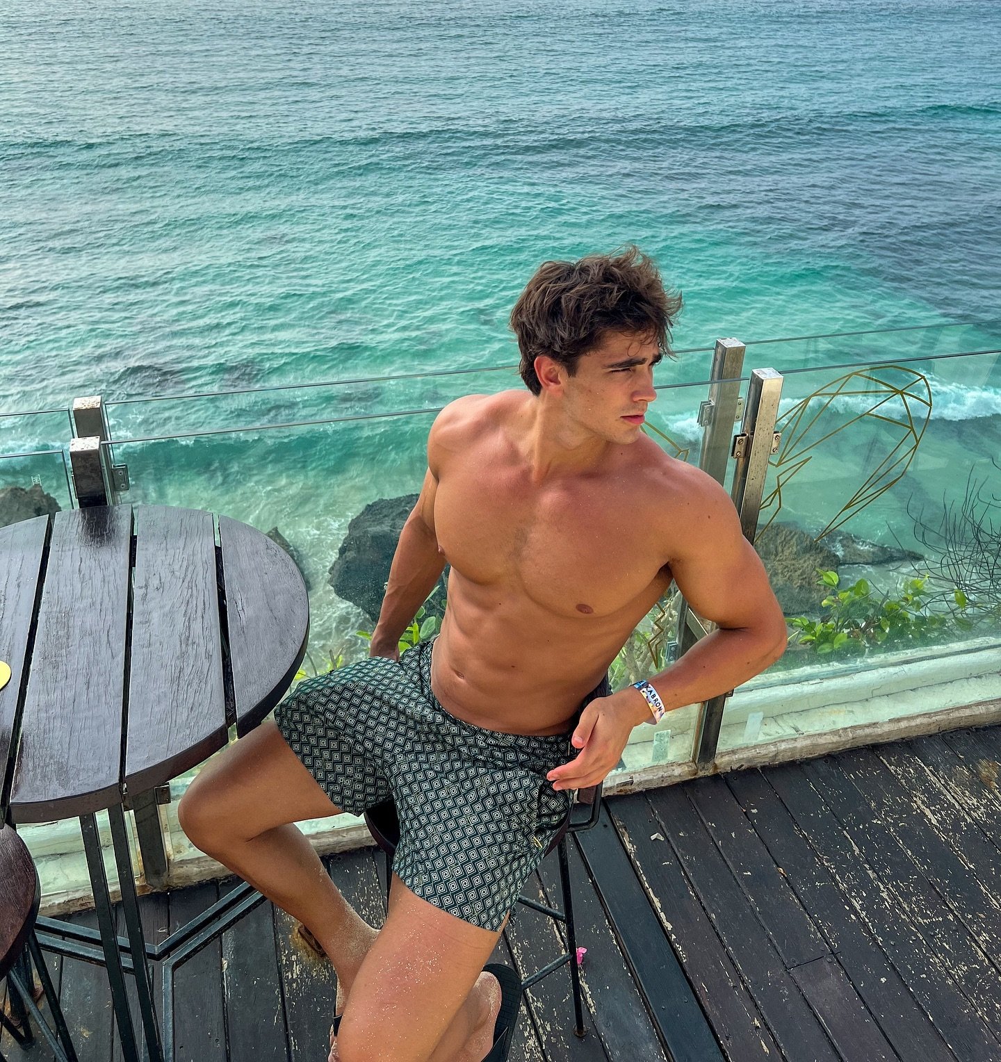 Shirtless city skyline shot from a travel feed